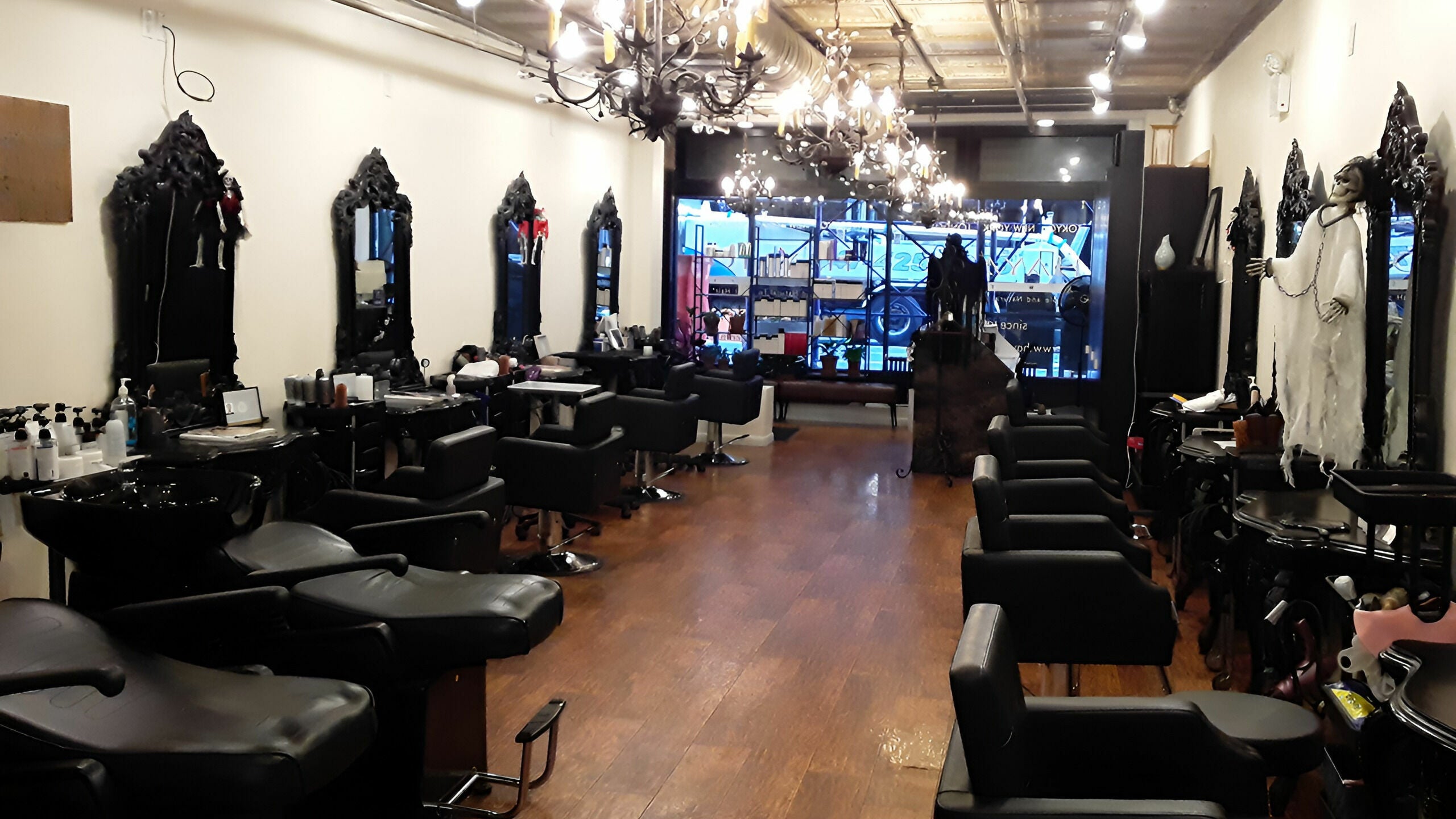 Elegant interior of Hayato New York salon in New York, New York, US with stylish chairs and mirrors.