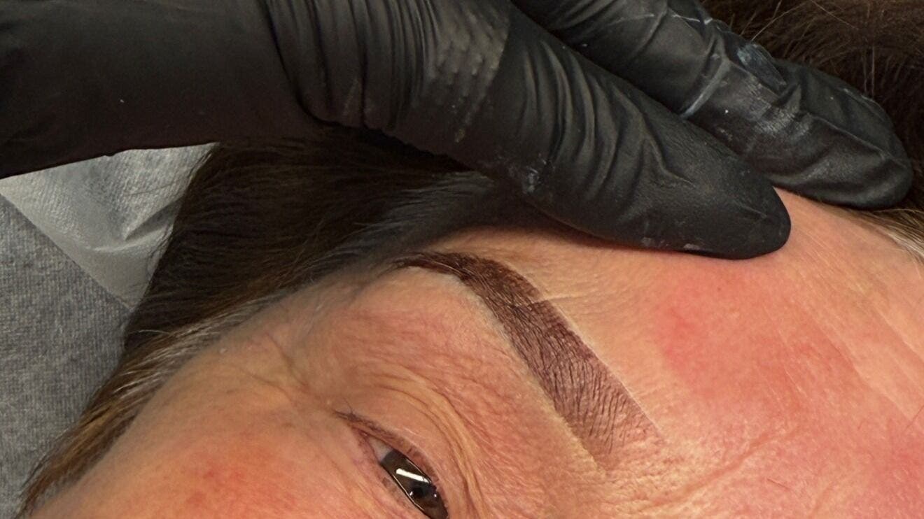 Close-up of eyebrow tattooing at SAINTLUXE BEAUTY in Melbourne, Victoria, AU by skilled technician.