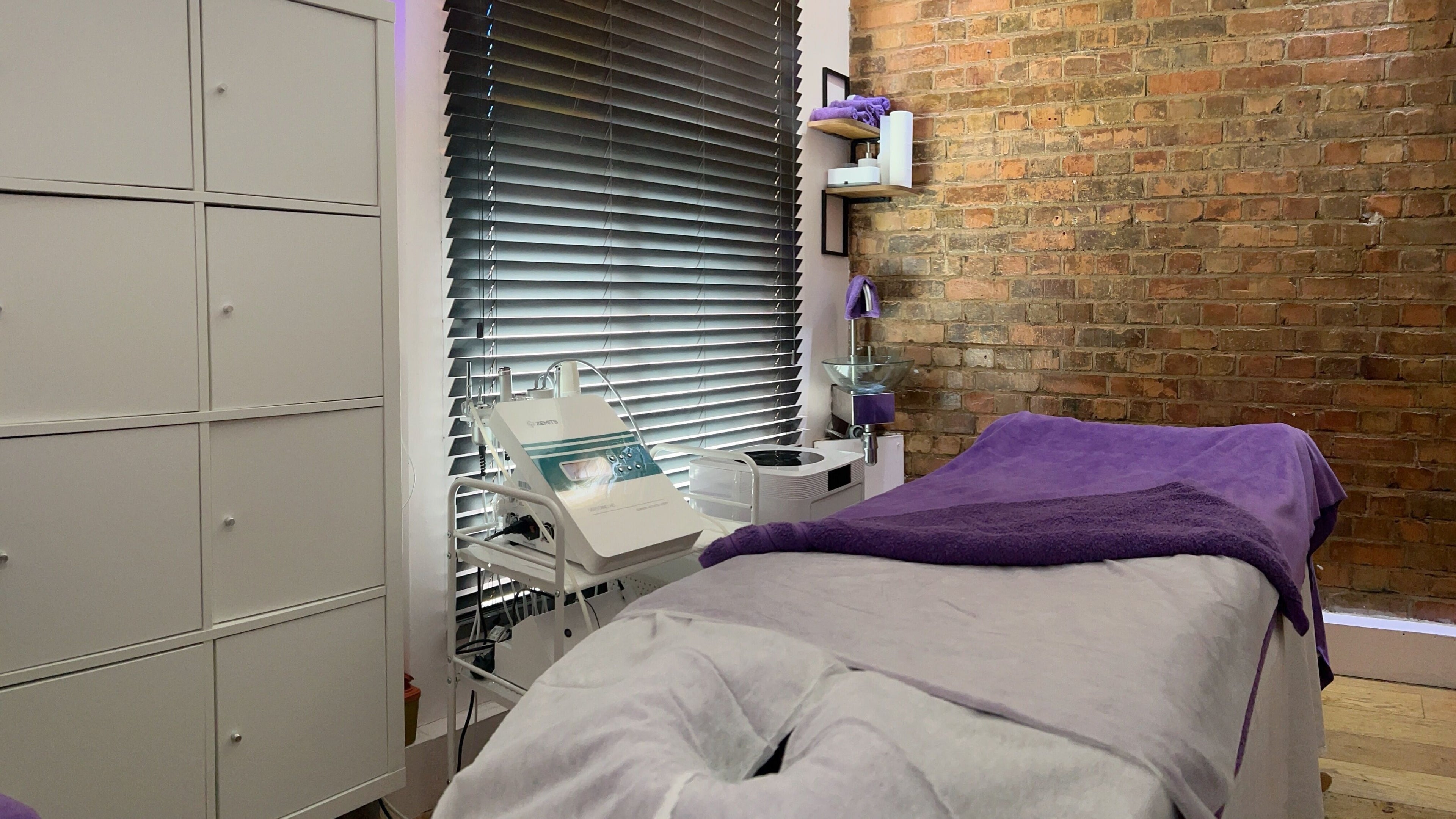 Peaceful treatment room at Pebble Beauty London, featuring cozy decor in London, England, GB.