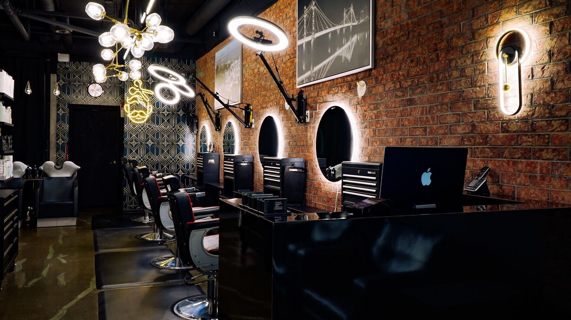 Interior of The Belmont - A Barber Collective with sleek chairs and mirrors in Calgary, Alberta, CA.