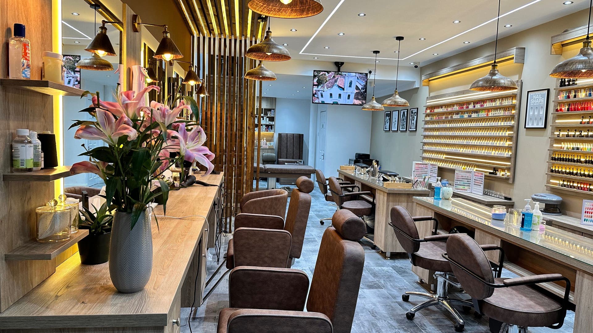 Chic interior of Mary's Hair Nail & Beauty in Glasgow, Scotland, GB showcasing stylish seating and vibrant decor.