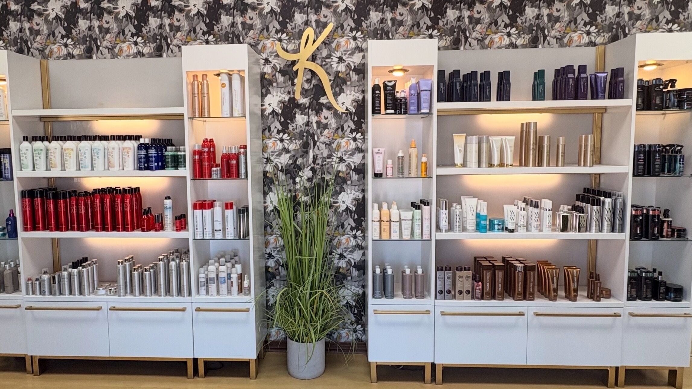Stylish product shelves at K salon in Meridian, Mississippi, US showcasing premium beauty essentials.