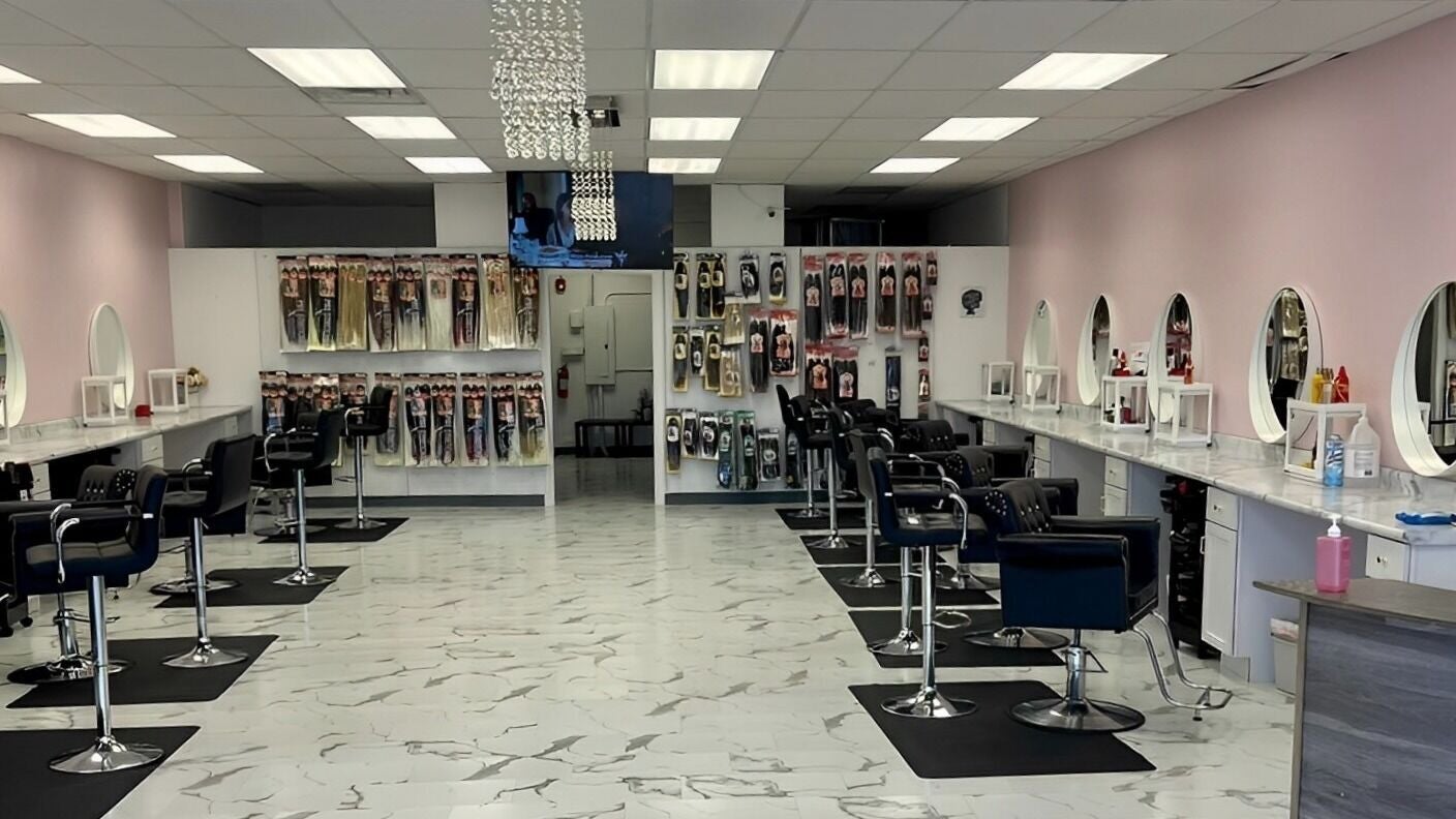 Spacious A&O Braiding salon in Woodridge, Illinois, US with stylish chairs and hair products displayed.