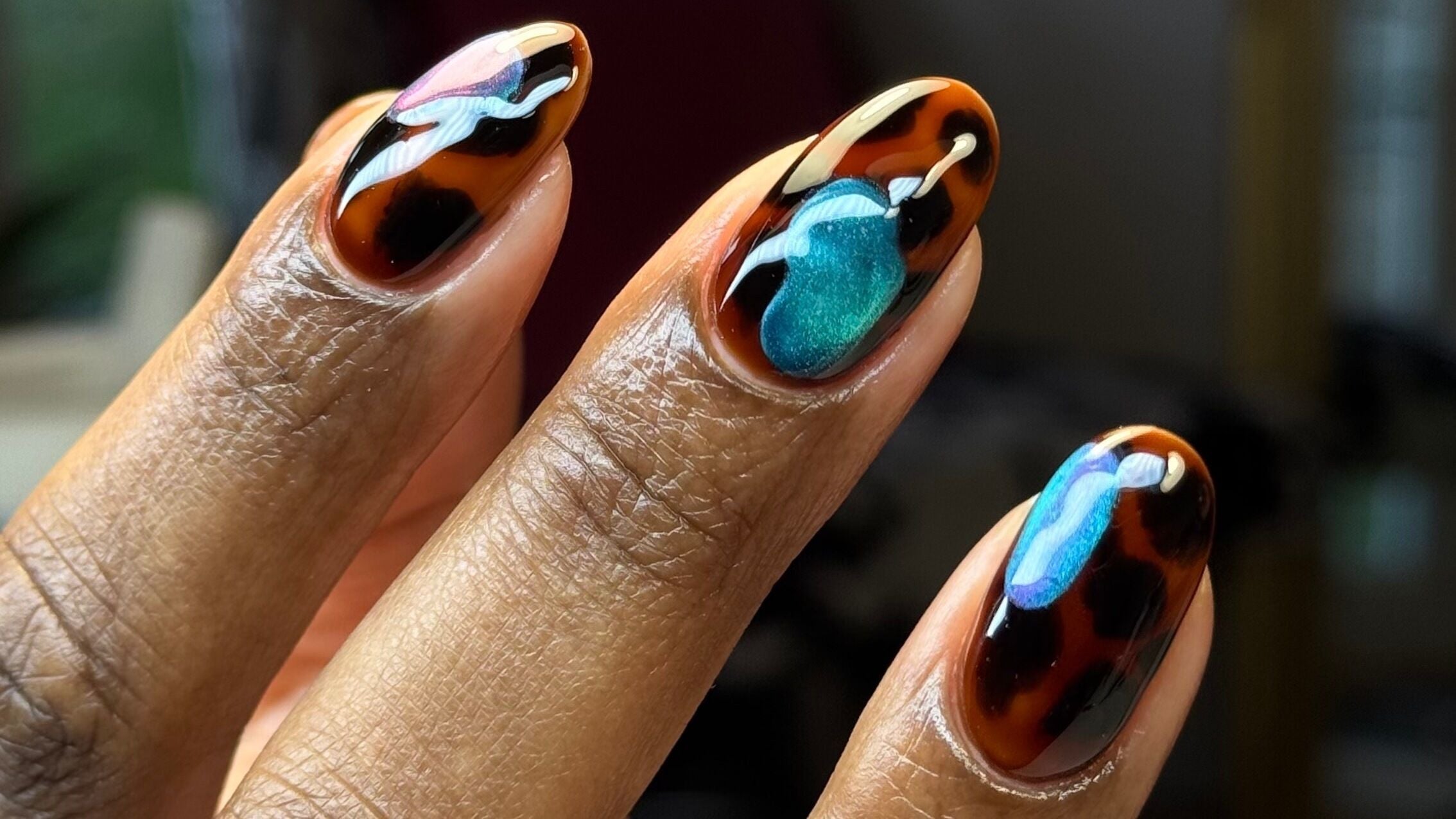 Colorful nail art at Desired Effect, New Addington, England, GB. Bold designs with vibrant colors.