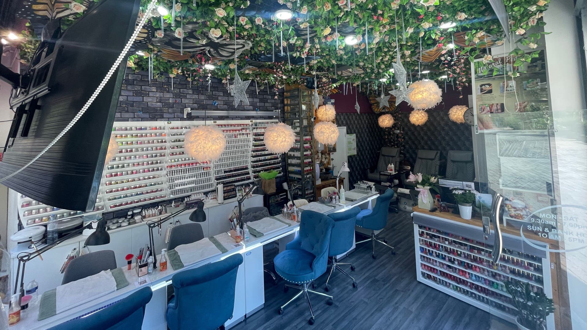 Elegant interior of Lily’s Nails and Beauty in London, England, GB with stylish nail stations and vibrant decor.