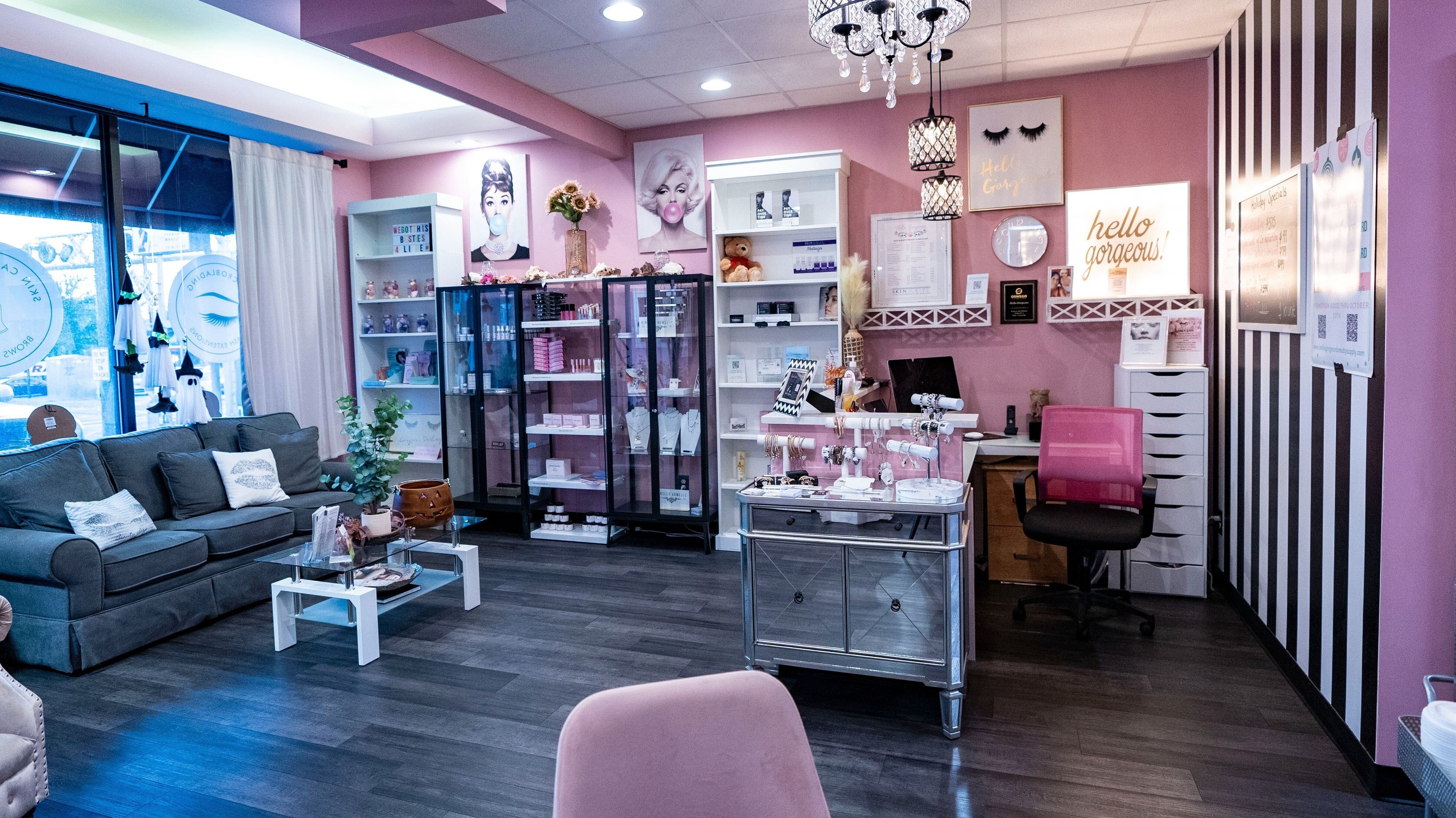 Elegant interior of Hello Gorgeous Med Spa in Oswego, Illinois with plush seating and beauty displays.