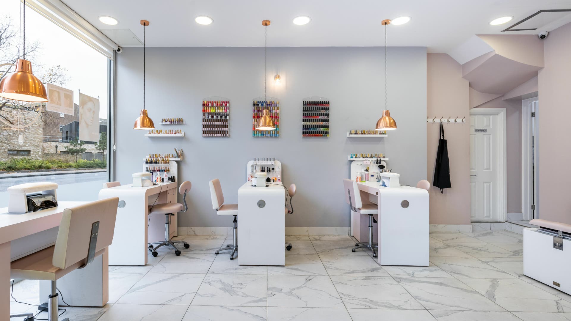Bright, modern nail studio at The Beauty Retreat Islington, London, England, GB with sleek stations and colorful polish.