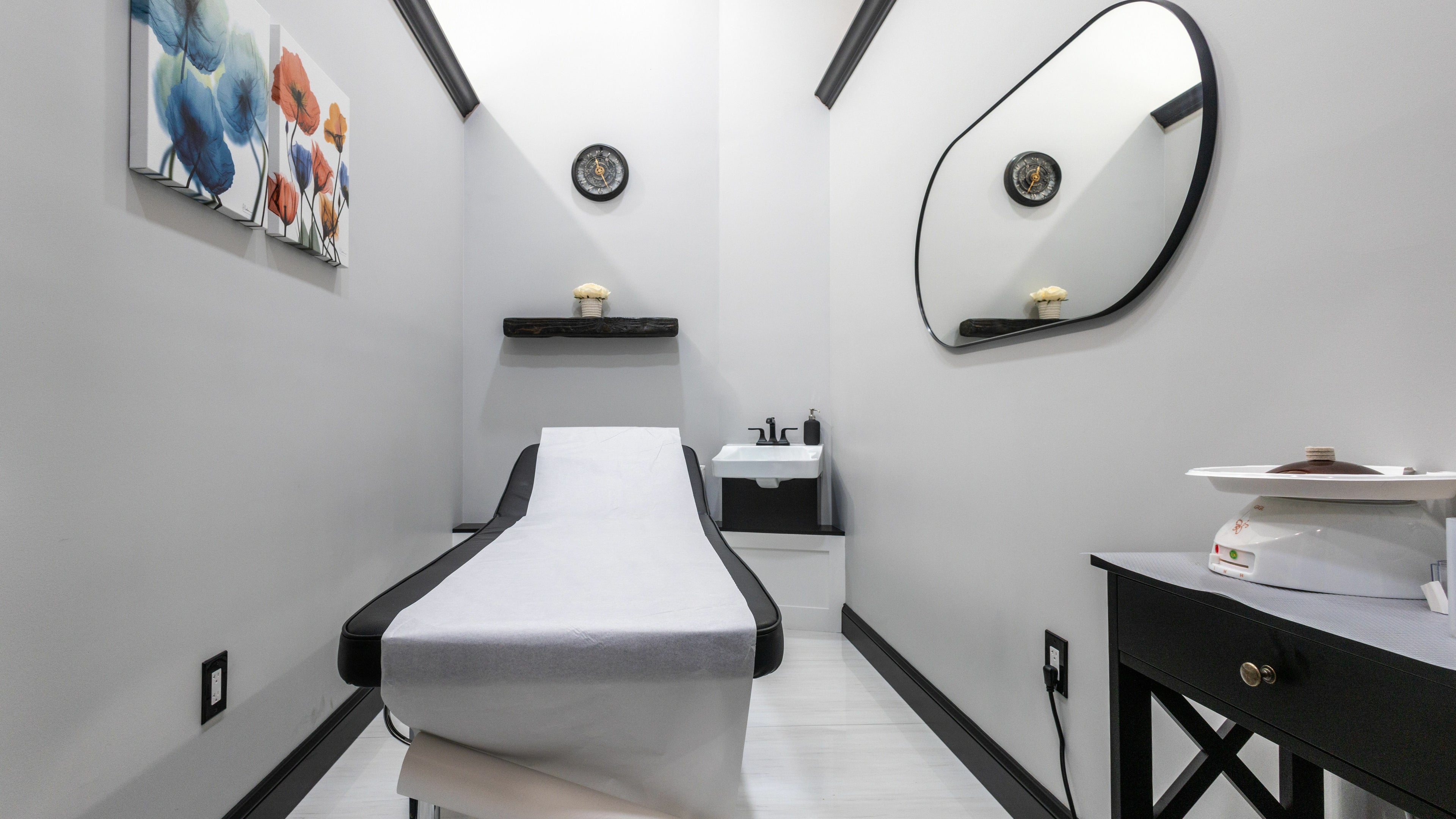 Relaxing treatment room at Top Nails Spa II in Closter, New Jersey, US, featuring modern decor and a massage bed.