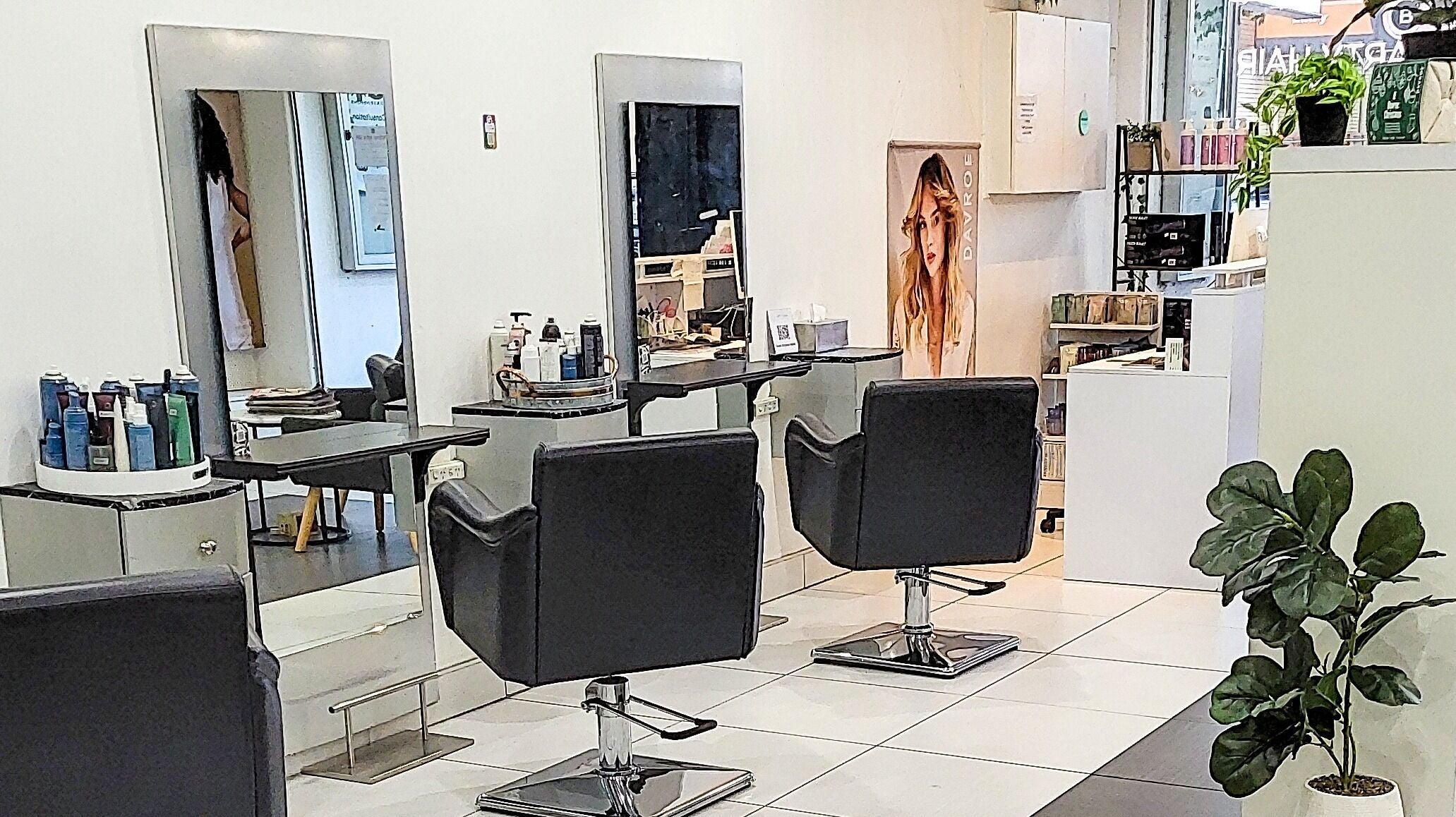 Modern styling chairs at Kristy Campbell at Arty Hair Studio, Werribee, Victoria, AU offer a chic salon experience.