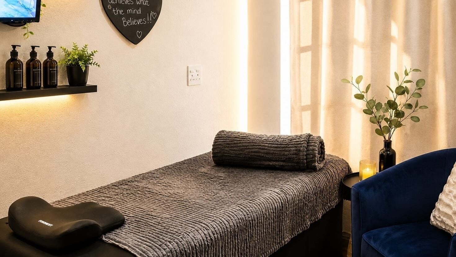 Relaxing treatment room at J & L Beauty Salon in Centurion, Gauteng, ZA, featuring a plush massage table and soft lighting.