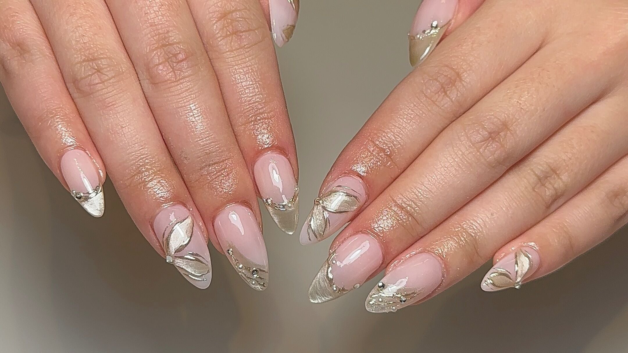 Stylish nail art with metallic accents at Petite Beauty Bar in Melbourne, Victoria, AU.