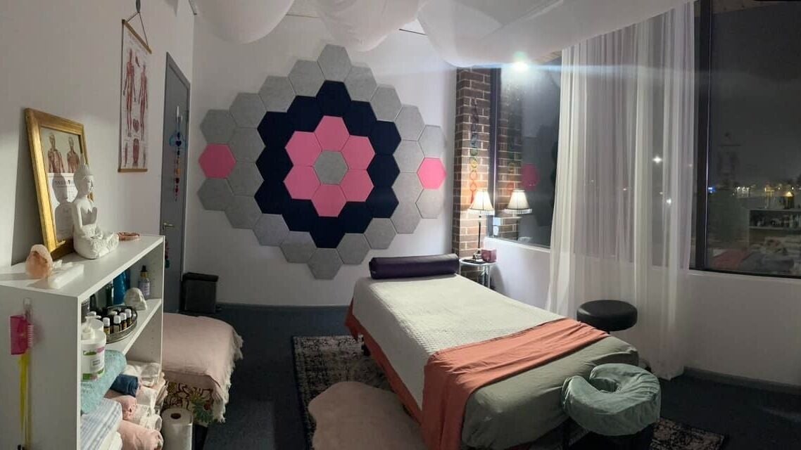 Cozy massage room at Mindful Body Studio in Hickory Hills, Illinois, US with soothing decor and soft lighting.