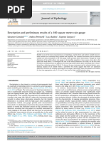 Description and Preliminary Results of A 100 Square Meter Rain Gauge