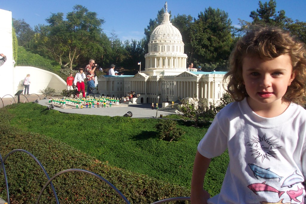 My five years old daughter is standing on the left. The capitol building and other buildings in Washington DC are in the background.