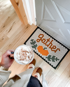 The Gather Round November Design of the Month on a tile mat on a cream background. 