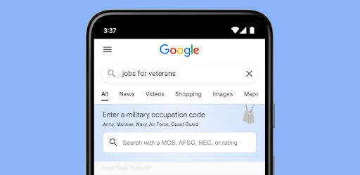 A smartphone displaying a Google Search bar with a function to find jobs using military occupation codes