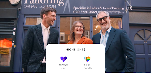 Google Maps UI showing three smiling people wearing tailored suits,  the text: Orhan Tailoring Business, and icons representing the business is woman-led, highly rated, and LGBTQ friendly