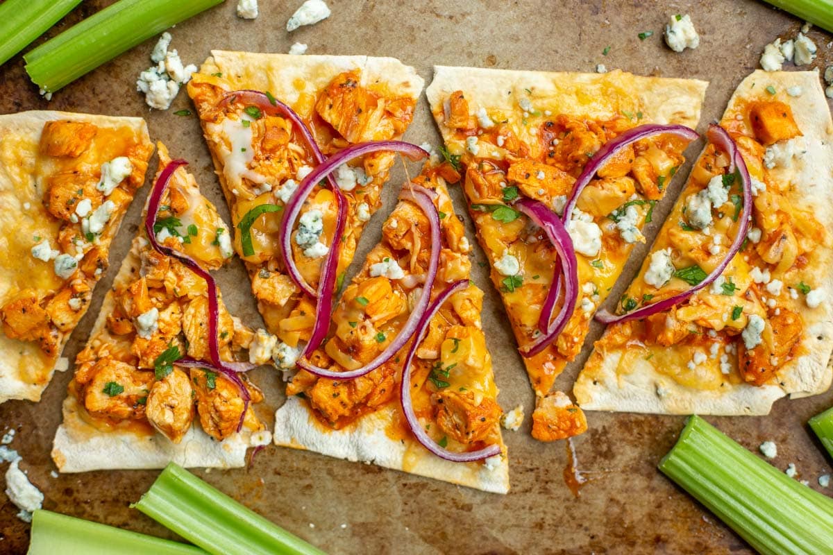 Try making either of these Healthy Flatbread Pizzas! Chicken Pesto Pizza and Buffalo Chicken pizza - BOTH full of flavor and low on calories! Buffalo chicken flatout flatbread pizza cut into slices