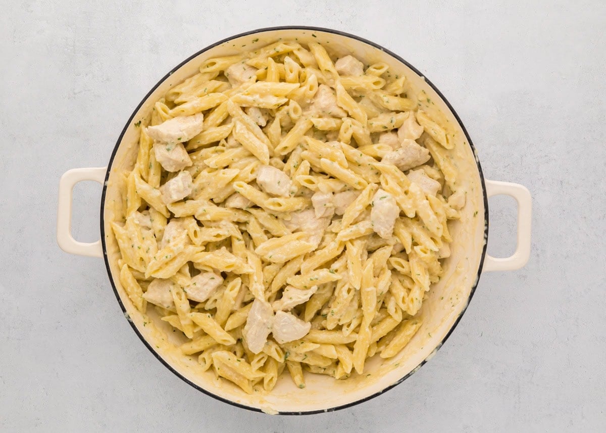 Creamy, cheesy, and ready in 30 minutes, this classic chicken penne pasta is the ultimate weeknight comfort food. Chicken penne pasta in a dutch oven.