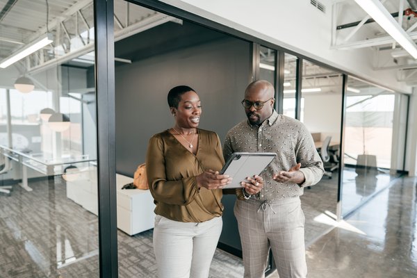 Two managers at work in a business office.