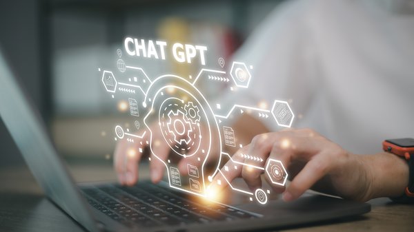 A graphic depicting someone using ChatGPT.