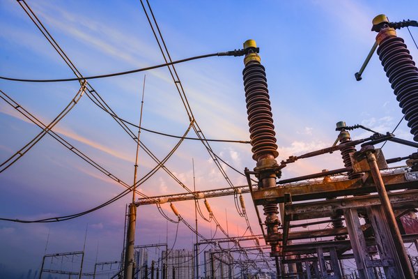 Rows of electrical wires and transformers.