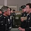 G.W. Bailey and Lance Kinsey in Police Academy 4: Citizens on Patrol (1987)