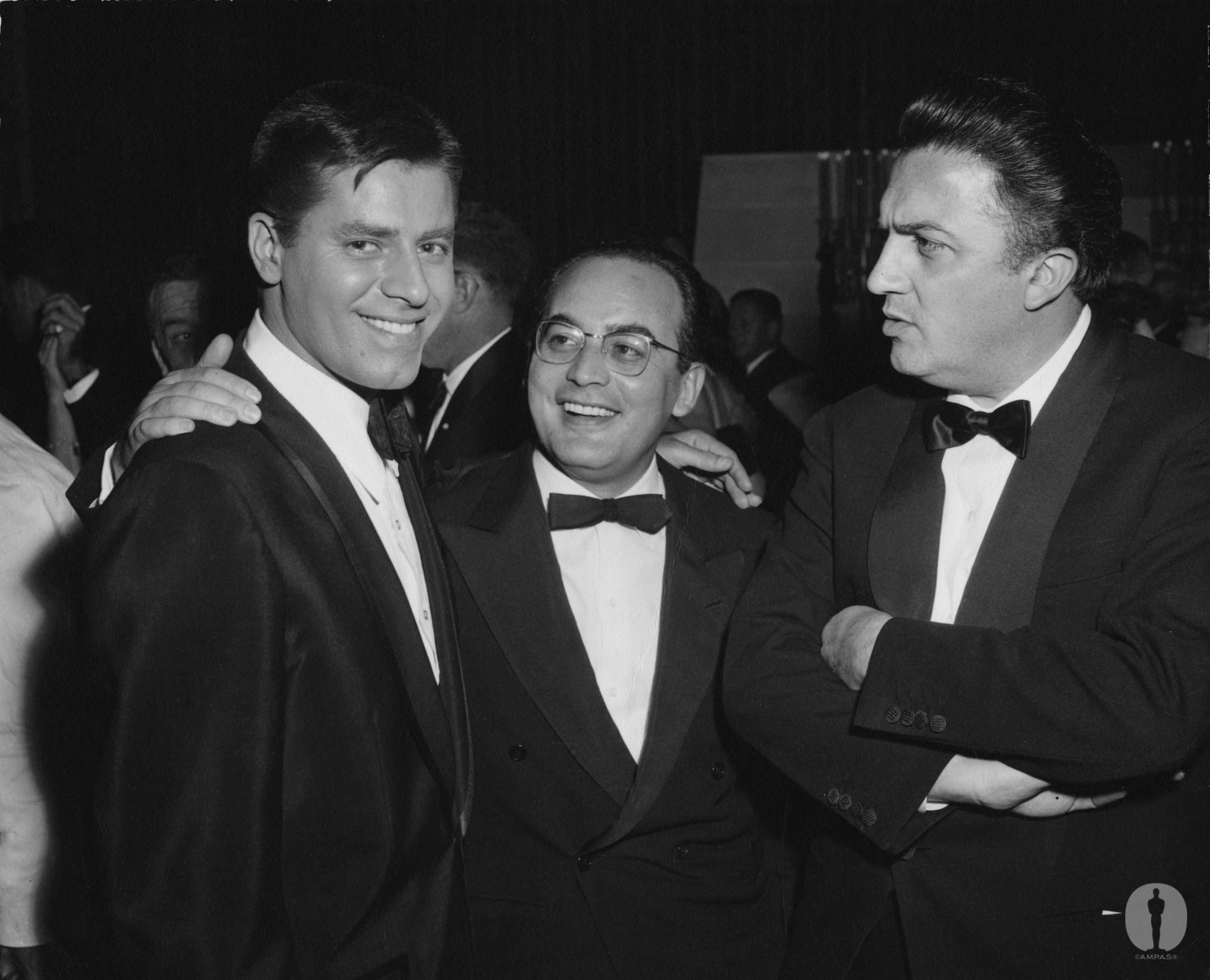 Jerry Lewis with Best Foreign Language Film producer Dino De Laurentiis and director Federico Fellini ("La Strada") at the 29th Academy Awards.