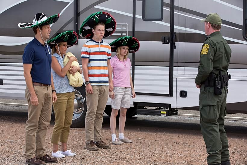 Jennifer Aniston, Emma Roberts, Jason Sudeikis, and Will Poulter in We're the Millers (2013)