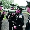 Steve Guttenberg, G.W. Bailey, Lance Kinsey, and Michael Winslow in Police Academy 4: Citizens on Patrol (1987)