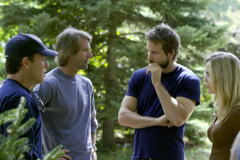 Producer BRAD FULLER, producer MICHAEL BAY, RYAN REYNOLDS, and MELISSA GEORGE on the set of THE AMITYVILLE HORROR.