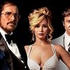 Christian Bale, Jeremy Renner, and Jennifer Lawrence in American Hustle (2013)