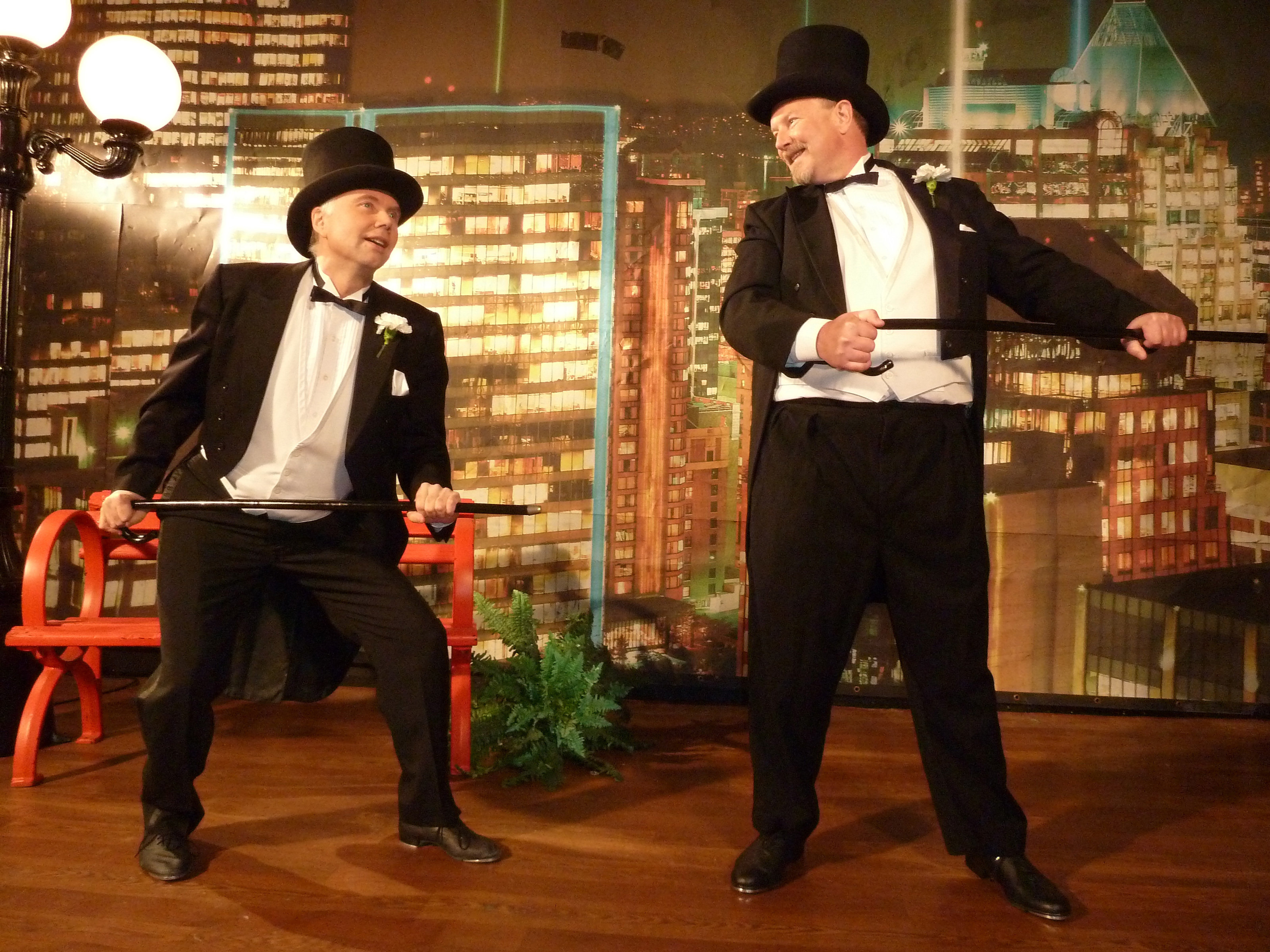 Mitch (actor Ross Munro) and Dunc (actor Robert David Duncan) dance in a Hollywood musical fantasy.  