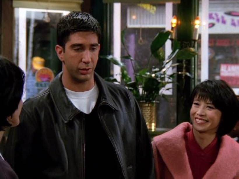 Courteney Cox, David Schwimmer, and Lauren Tom in Friends (1994)