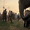 Danny DeVito, Colin Farrell, Deobia Oparei, Frank Bourke, Sharon Rooney, Ragevan Vasan, Finley Hobbins, Nico Parker, Miguel Muñoz Segura, and Zenaida Alcalde in Dumbo (2019)