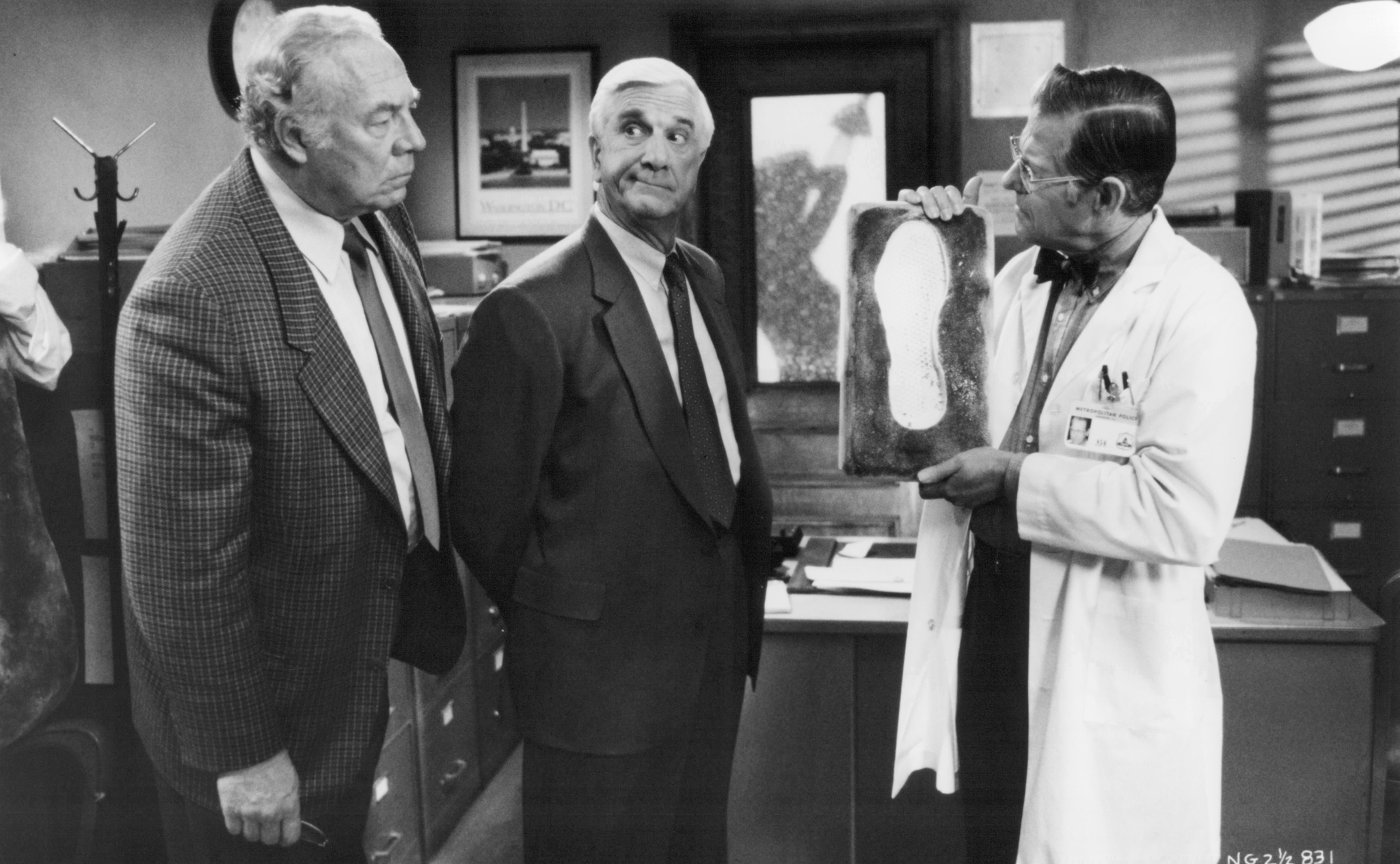 Leslie Nielsen, George Kennedy, and Ed Williams in The Naked Gun 2½: The Smell of Fear (1991)