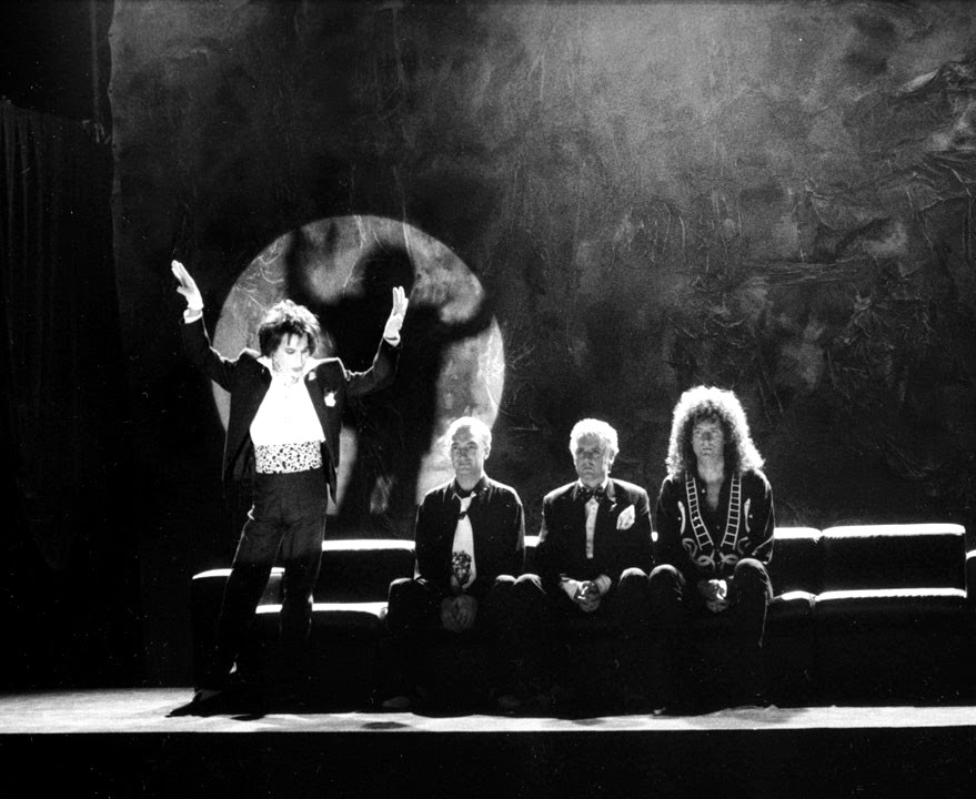 Roger Taylor, Brian May, Freddie Mercury, John Deacon, and Queen in Queen: I'm Going Slightly Mad (1991)