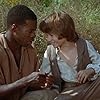 Elijah Wood and Courtney B. Vance in The Adventures of Huck Finn (1993)