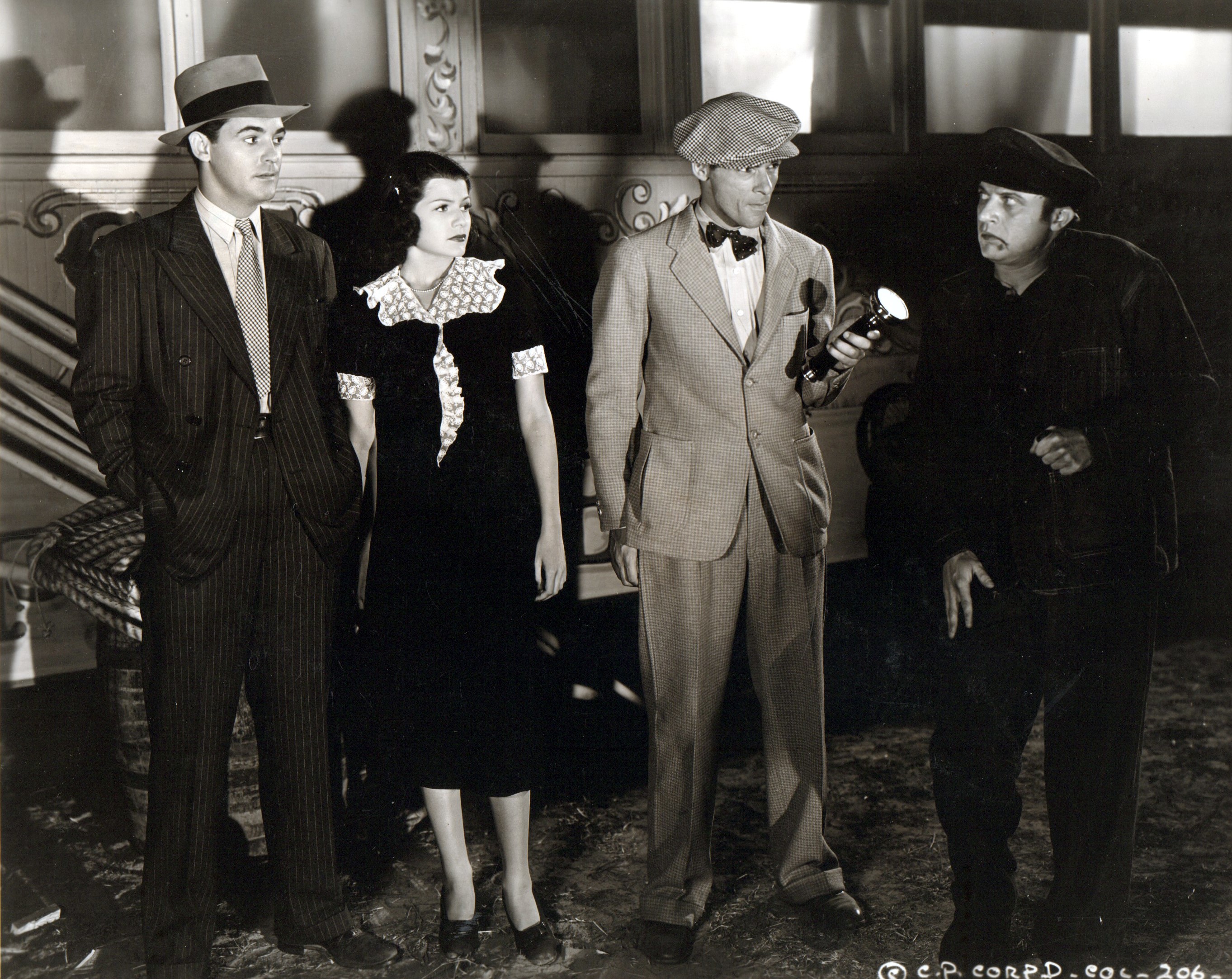 Rita Hayworth, Dwight Frye, Marc Lawrence, and Charles Quigley in The Shadow (1937)