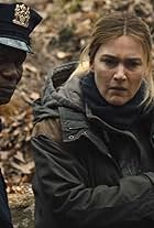 Kate Winslet and John Douglas Thompson in Mare of Easttown (2021)