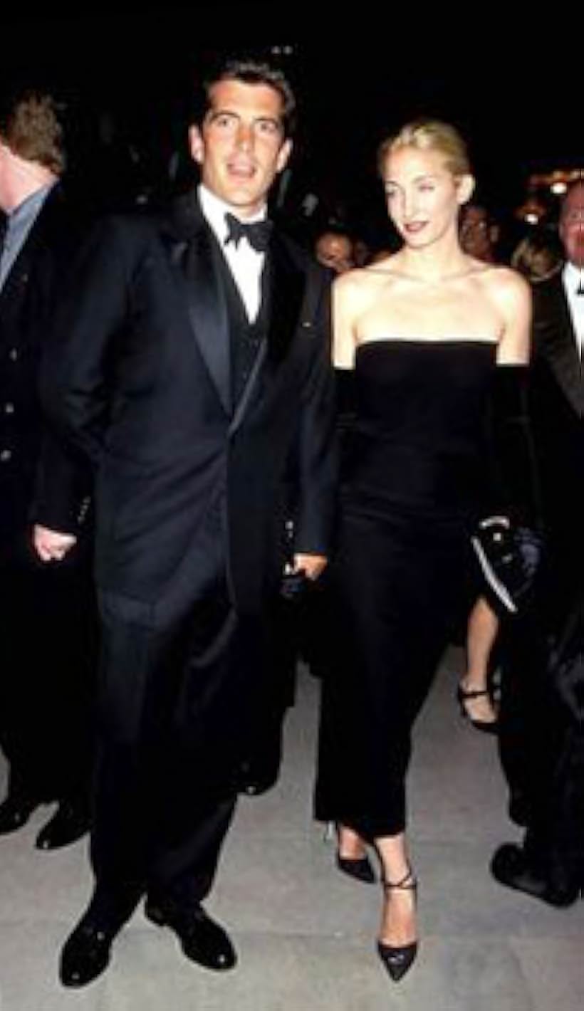 John Kennedy Jr. and Carolyn Bessette-Kennedy at an event for The Kennedys: The Curse of Power (2000)