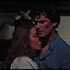 Betsy Baker and Bruce Campbell in The Evil Dead (1981)