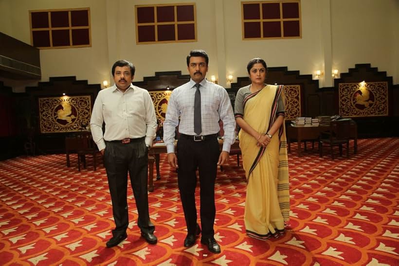 Ramya Krishnan, Suriya, and Sathyan in Thaanaa Serndha Koottam (2018)