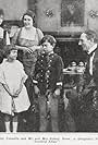 Bobby Connelly, Mrs. Sidney Drew, Sidney Drew, and Anita Snell in A Youthful Affair (1918)