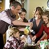 Julie Warner, John Ratzenberger, Dixie Carter, Steven Eckholdt, Grace Caroline Currey, Cassi Thomson, and Maxim Knight in Our First Christmas (2008)