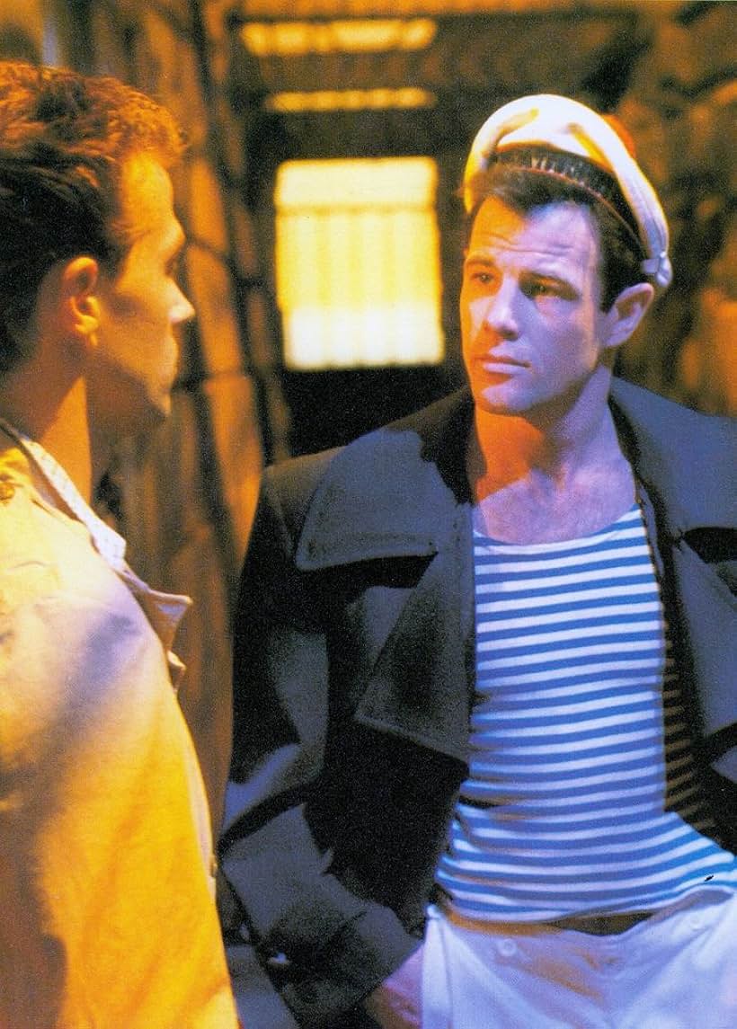 Brad Davis and Laurent Malet in Querelle (1982)