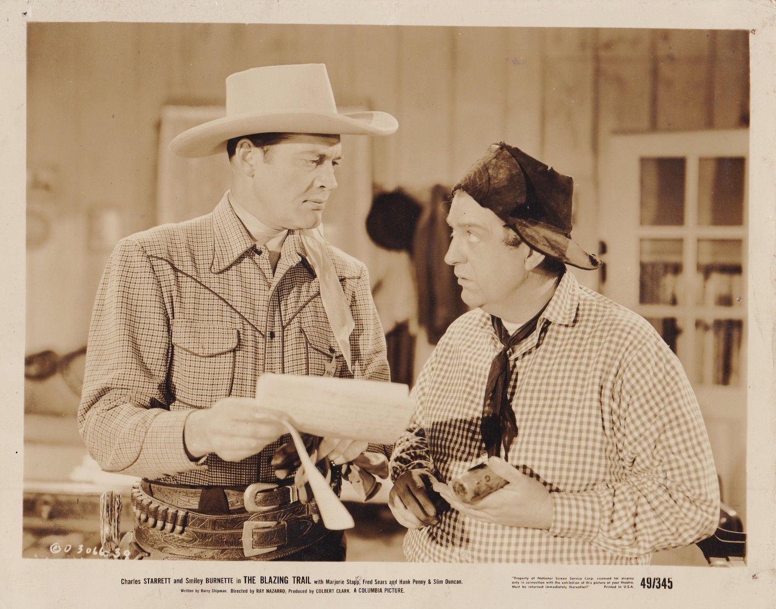 Smiley Burnette and Charles Starrett in The Blazing Trail (1949)