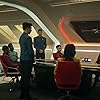 Rebecca Romijn, Anson Mount, Ethan Peck, Paul Wesley, Celia Rose Gooding, Babs Olusanmokun, Christina Chong, and Melissa Navia in Star Trek: Strange New Worlds (2022)