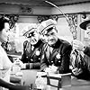 Pat Flaherty, William Lundigan, Brenda Marshall, and Frank Wilcox in Highway West (1941)