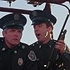 G.W. Bailey and Lance Kinsey in Police Academy 4: Citizens on Patrol (1987)